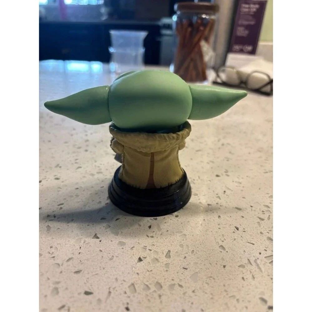 grogu the child eating a cookie star wars funko pop